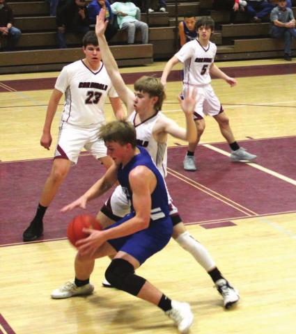 Lingleville Cardinals Augustus Boeve, Connor Hilburn and Cade Lingle move in on a Cherokee ballhandler during Saturday’s Regional Quartefinal Championship Game. The Cards claimed the title with a 42-38 win. Sara Gann | Citizen staff photo