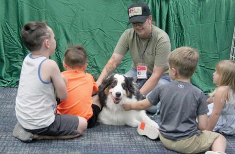 Lyndi Hanna and Hank of Annie Therapeutic Companions teaches kids at Dublin Public Library about the need for registered animal therapy teams. The program, organized by Lyndi, showcased working dogs including a K9 officer, a therapy dog and an arson detection dog Thursday, July 11 as part of special programs for the Summer Reading Club. Wyndi Veigel-Gaudette | Citizen staff photo