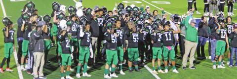 The Dublin Lions (above) raise up fingers during the school song moments after claiming the Area championship title for the first time in school history. Players Christian Ramirez and Cooper Pickett run to each other and shout in celebration. Paul Gaudette | Citizen staff photo