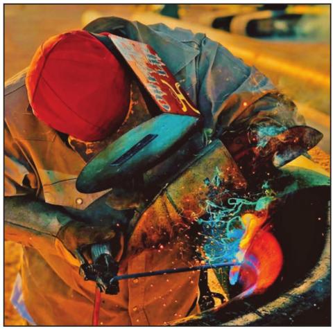 Pablo Melendres at work, welding