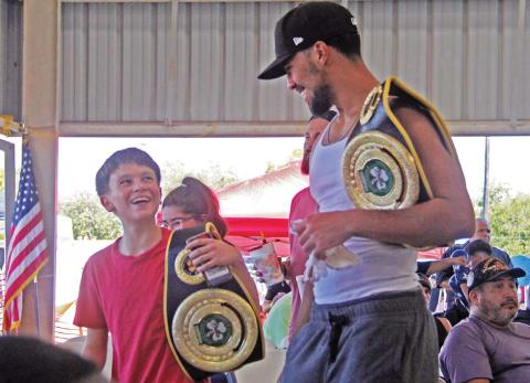 Boxers hold winning belts as they exit the annual Lights Out Boxing Tournament held by Stephenville Boxing Club at the annual Dublin Chamber of Commerce Hispanic Heritage Festival at the Dublin City Park Saturday, Sept. 21. For more photos see The Dublin Citizen Facebook page. Paul Gaudette | Citizen staff photo