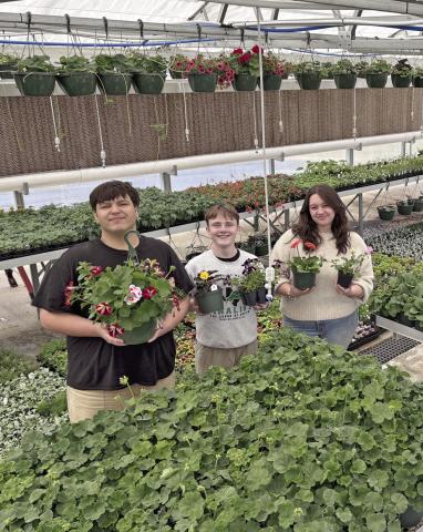 Dublin FFA students pose with some of the plants filling the greenhouse in preparations for the annual plant sale fundraiser April 11-12. Sophie Hayhurst | Submitted photo