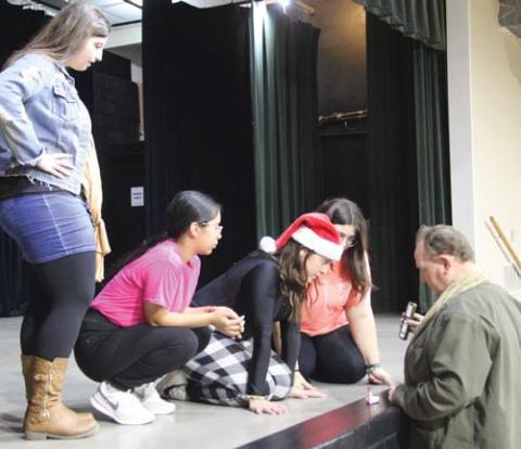 Members of the One Act Play review a video of a practice of their performance for the Christmas Spectacular Tuesday, Dec. 17. Tickets are by donation and benefit the theatre department. Paul Gaudette | Citizen staff photo