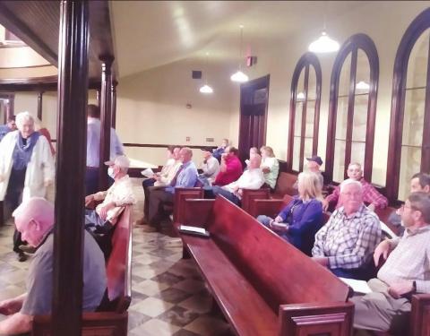 Erath County residents file in to the Commissioners Courtroom and the County Courthouse Tuesday morning as the commissioners decided on whether to freeze residence homestead taxes for Erath County residents 65 years and older. Paul Gaudette | Citizen staff photo
