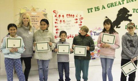 ‘Paws’itive Leaders Dana Sandoval and Jaron Winborn (4th grade), Cecilia Garcia and Luke Thompson (5th grade) and Arian Cormack and Harlyn Wiley(6th grade). Presented by Principal Amanda Lisso.