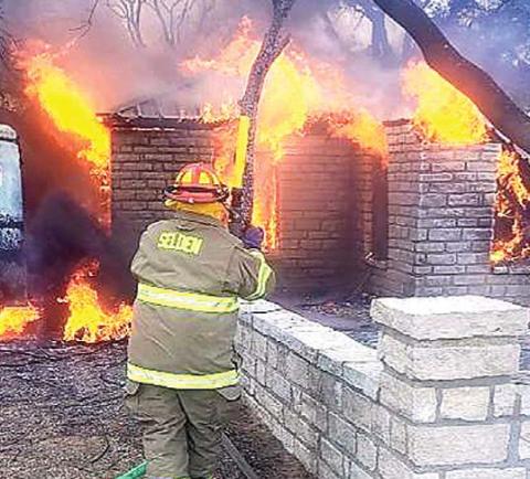 Members of the Selden Volunteer Fire Department work to combat a structure fire on County Road 209 near Duffau on Dec. 23. According to Erath County Fire Marshal Tommy Shelton, the cause of the fire in undetermined at this time. Submitted photo