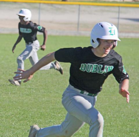 Dublin Lion Cameron Patton heads for home while Julian Calders sprints towards third in a recent away game. Paul Gaudette | Citizen staff photo