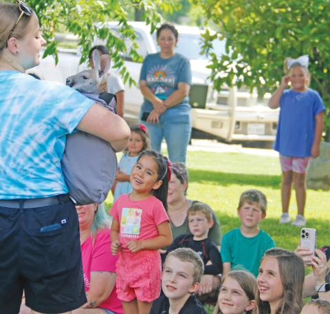 A crowd of kids and adults were awestruck on the Dublin Public Library lawn Thursday, June 5 as the Creature Teacher volunteers brought a crew of critters for their annual appearance in the Summer Reading schedule. Above, young fans look up to Angus, the young red kangaroo with adoration. See more photos of the creatures in attendance on Page 5. See the Community Calendar on Page 3 to check out what’s going on at the library and in the community. Paul Gaudette | Citizen staff photo
