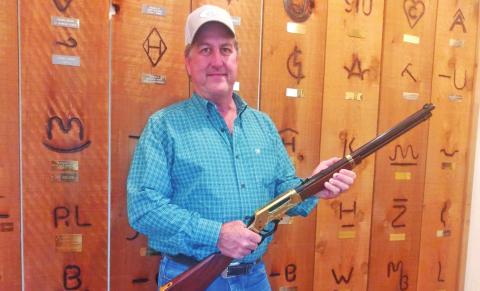 Raffle winner accepts rifle