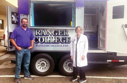 J. D. Gambino, Ranger College EMS Program Coordinator, and Dr. Sandra Lee, Dean of Allied Health, pose next to the college’s Mobile Ambulance Simulator. The college received a Texas Workforce Commission grant that allowed for the expansions of the school’s EMS program. | submitted photo