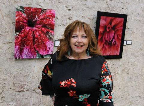 Cross Timbers Fine Arts Council hosted an exhibition and artist reception Saturday, March 29 for 'Gaze' featuring the macro botanical photography of Dedra Shahan. Shahan used her iPhone and no editing to showcase beautiful color around her home and on adventures. CTFAC provided refreshments and harp music with the exhibit. Paul Gaudette | Citizen staff photo
