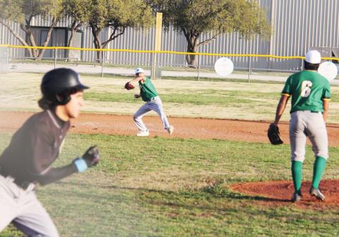Paul Gaudette | Citizen staff photo Dublin Lion Cesar Caldera (in background) lobs the ball past pitcher Jose Lopez to Cooper Pickeet on first base to out a Comanche runner in the home game Friday.