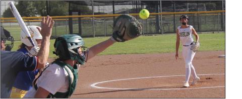 Dublin varsity Lady Lion Catcher Cassidy Adair leans in to receive a pitch from Olivia Salyer during the March 31 home against Brock, which resulted in a loss for the home team. The Lady Lions continued to grow as a team against tough opponents with an away loss to Eastland on March 28 before returning home for the Brock game. Wyndi Veigel I Citizen staff photo