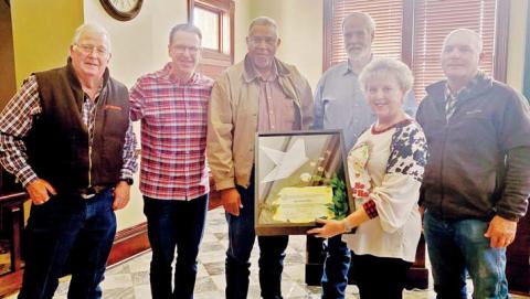 Tax Assessor-Collector Jennifer Carey was presented a plaque and flag from the Erath County Commissioner’s Court as she attended her last Commissioner Court meeting Tuesday, Dec. 17. She is retiring after working as Tax Assessor-Collector for 40 years. Wyndi Veigel-Gaudette | Citizen staff photo