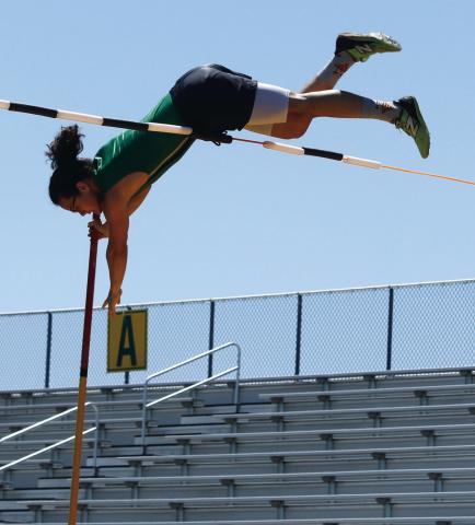Travis Spharler vaults up in runthroughs before claiming first in the varsity boys pole vault competition April 8 at Cervetto Field. Paul Gaudette | Citizen staff photo