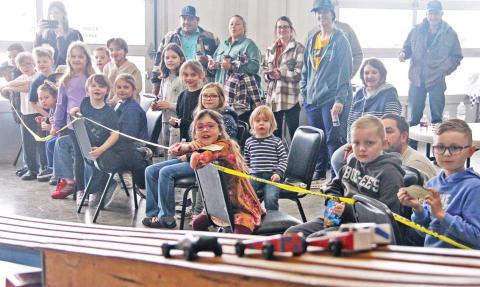 Members of Cub Scout Troop No. 35 eagerly watch to see which car makes it down the track the fastest at the annual Pinewood Derby Saturday, Feb. 22. For more photos see The Dublin Citizen Facebook page. Paul Gaudette | Citizen staff photo