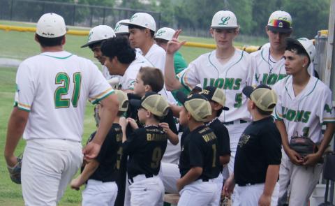 Dublin Lions were joined by young baseball players in the dugout Friday, April 17 as youth league athletes took the field for the opening pitch and National Anthem. Paul Gaudette | Citizen staff photo