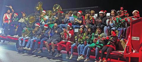 The Dublin High School band is carried on a truck for the Christmas Parade by Bradberry’s Best, embracing the ‘You Call and We Haul’ slogan on the truck. Paul Gaudette | Citizen staff photo