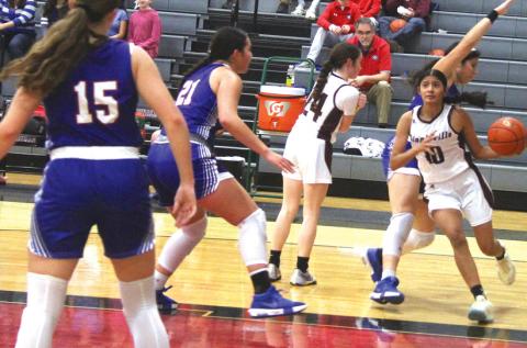 Lingleville Lady Cardinal Ciklali Rangel moves the ball around Gorman defense in the Dec. 17 home game. Paul Gaudette | Citizen staff photo