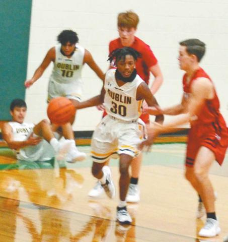 Dublin Lion Javion Ray recovers the ball from Hamilton after the teams fought for possession during Saturday’s home game. The Lions won the battle 64-51, bringing their record to 4-2 heading into Tuesday’s games. This win came after a 64-72 loss to Coleman in an away game Friday night. Paul Gaudette | Citizen staff photo