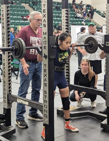 Dublin Lifter Samantha Marinez is watched over by coaches at the Dublin invitaional powerlifting meet Saturday, Jan. 18 where she took second in her class. At right, Cassidy Adair (spotted by her brother, Roger) took first in her class while Alonso Moreno took second in his division. Paul Gaudette | Citizen staff photo