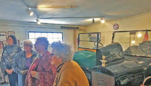 Daughters of the Republic of Texas members listening to the guide in the Antique Car Museum. | Citizen staff photo