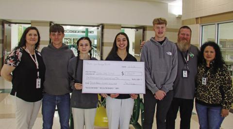 Four DHS seniors were awarded third place and $1,500 in scholarships to split as part of the Texas Midwest Community Network Leadership contest for constructing, installing and stocking raised flowerbeds near the Dublin City Park sign. Pictured are advisor Regina Rasberry, Tatum Babkowski, Emma Mitchell, Olivia Salyer, Hayden Milburn, advisor Shawn Bradford and Secondary School principal Dr. Norma Villicana- Arreguin. Paul Gaudette | Citizen staff photo