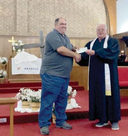 Larry Stanford with the Stephenville Area Elks Lodge No. 2834 is shown presenting a check for $6,000 to Pastor Danny Pelton of First Methodist Church of Dublin to be used for Community Table and food pantry. The Elks are able to do this through the Beacon and Spotlight grant offered through The National Elks Grand Lodge. Submitted photo
