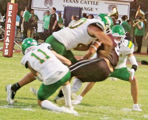 Dublin Lions Kyson Gilman, Joe Salinas and Hudsen Joslin box in a DeLeon ballcarrier to bring him down during the first game of the season Friday, Aug. 29 at DeLeon. Paul Gaudette | Citizen staff photo