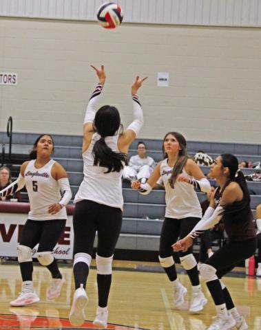 Lingleville Lady Cardinal Denise Toledo keeps the ball alive in a Sept. 13 tournament game at Lingleville while fellow Lady Cards flock in to return it to the opposition. Paul Gaudette | Citizen staff photo