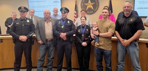 Stephenville K-9 Officer Colby Stone and Erath County Deputy Taylor Tully were presented with a lifesaving award by the Stephenville PD and ECSO for helping to save a stabbing victim. They were presented the awards Tuesday, May 6 by Police Chief Dan Harris, Sheriff Matt Coates and their families. Wyndi Veigel-Gaudette | Citizen staff photo