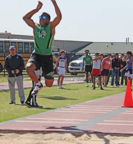 Tyler Harrell (seen here in the Triple Jump) broke the school record in the long jump on April 13 with his first place finish at the District track meet in Dublin. Paul Gaudette | Citizen staff photo