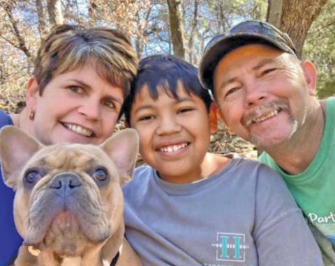 Kimberly, Rhett and Richard Reed with their dog, Remington.