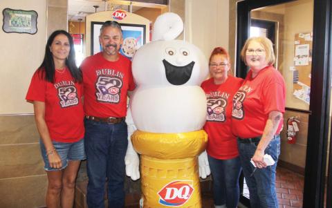 Lisa and David Fritts, owner of the Dublin Dairy Queen, along with Curly Top (Makayla Taff), Dublin Manager Shanna Phelps and District Manager Myra Sojourner welcome customers to DQ for the eateries 50th aaniversary. Below, citizens check out classic cars in the parking lot of DQ. Cierra Hawk | Citizen staff photo
