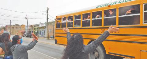 A crowd of Dublin well-wishers gathered in the Sunday morning fog at the Corner Lot to send-off the Dublin High School Cross Country Runners who had advance to Regionals held Monday in Lubbock. The team was seen off by spirited cheerleaders of all ages.. Paul Gaudette | Citizen staff photo