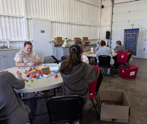 Volunteers help stuff thousands of Easter eggs at one of two Egg Stuffing Parties held in March at The Station. The annual hunt will have more than 17,000 eggs filled with candy, toys and other prizes. Paul Gaudette | Citizen staff photo