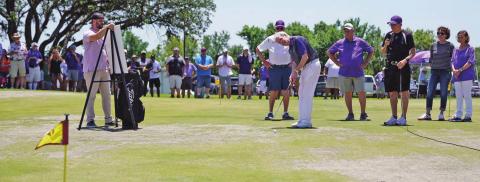 The gallery stands quietly as a team takes their shots during the 30th Annual Perry Elliott Plowboy Shootout at Squaw Valley Creek Golf Course on Friday. The tournament benefitting the Tarleton Athletics program drew 244 golfers to compete. Cooper Ross | submitted photo