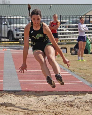 Dublin High School Junior Olivia Salyer comes back down to Earth in the girls long jump event at Dublin High School. She is advancing to Area after placing third. Paul Gaudette | Citizen staff photo