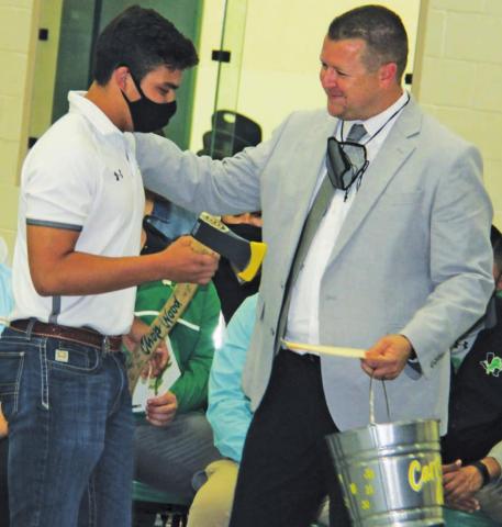 Dublin Basketball player Chris Teten presented Coach Will Parker with an axe and pail reading “Chop wood, carry water” during Thursday’s Athletic Awards at the Secondary School gym. The slogan was a rallying cry for the team through the 2020-21 season. Wyndi Veigel | submitted photo