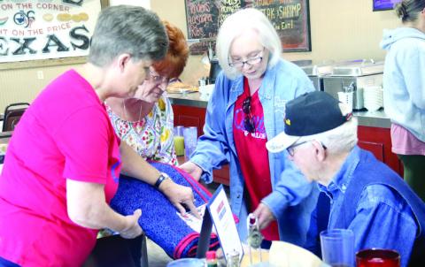 Quilters Debbie Stubbs, Judy Angle and Peggy DeLavergne present a Quilt of Valor to Air Force veteran Robert Earl at a special presentation Saturday, May 2 at Granny Clarks. Wyndi Veigel-Gaudette | Citizen staff photo