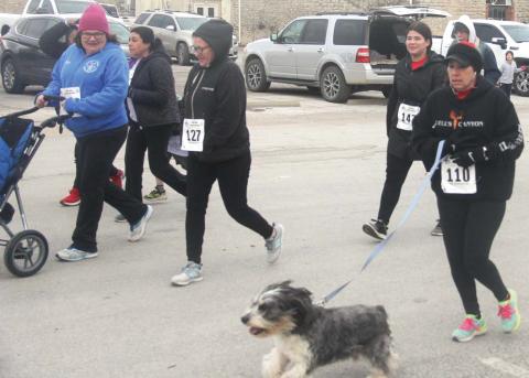 Love run draws cold, caring crowd A total of 60 human and a handful of pets braved the cold weather Feb. 12 to participate in the annual Love Run 5K and fun run benefitting Transformation Pathway. They were cheered on at the start/finish line by people waving signs saying things like “You’ve got this!” and “I trained all week to hold this sign!”