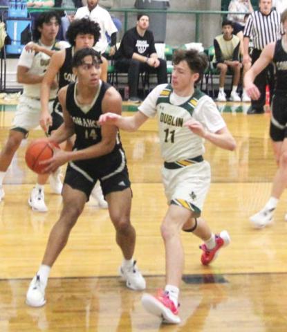 Dublin Lions Kyson Gilman and Frincisco Garcia fight Comanche for the ball during the Feb. 2 home game. Paul Gaudette | Citizen staff photo