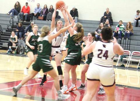 Lingleville Lady Cardinals wrestle for the ball under the net during the home game on Friday, Jan. 19. The Lady Cards claimed the win 51-9, bringing their district record up to 4-4 after the Tuesday, Jan. 16 loss to Strawn 44-37. Paul Gaudette | Citizen staff photo