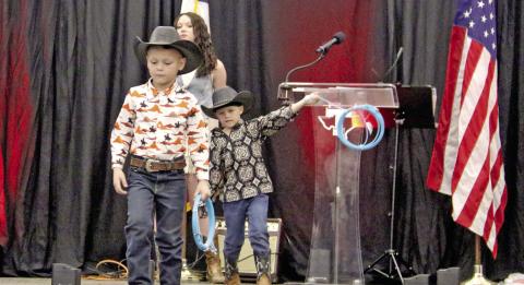 Wyndi Veigel-Gaudette and Paul Gaudette | Citizen staff photos Young cowboys model western wear from Rope Your Style in Early during the 9th annual Simply Dangerous event Saturday, Feb. 28. Below left, Golden Chick Managers Ryan Raborn (along with Marcia Raborn) receives Sponsor of the Year award from Lilly G Arena Productions. Below right, Dublin Dairy Queen Manager Shanna Phelps accepts the Top Hand Business award from Lilly G’s owner Rick Taylor.