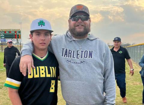 Chad Rasberry, right, stands with his son Charlie after a baseball game. A Gofundme account has been started to assist with medical and family needs associated with Chad’s recent illness. Courtesy photo