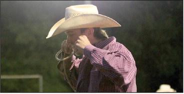 Left, a cowboy prepares for the tie down roping event at Saturday night’s rodeo. The Friday and Saturday rodeo allowed competitors a last chance to earn some points in this year’s season. Below, a saddle broc rider safely dismounts. A kid hangs on during mutton busting. Paul Gaudette and Wyndi Veigel | Citizen staff photos