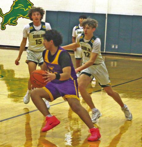 Dublin JV Lions cover an Early Longhorn advancing the ball during a home game Friday, Jan. 16. Lions scored a 61-45 win in the battle. Paul Gaudette | Citizen staff photo