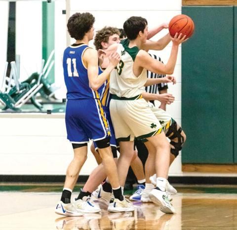 Dublin Lion Dane Lewis fights with Brock offense to claim the ball during the Feb. 9 home game. Danielle Meador | Citizen staff photo