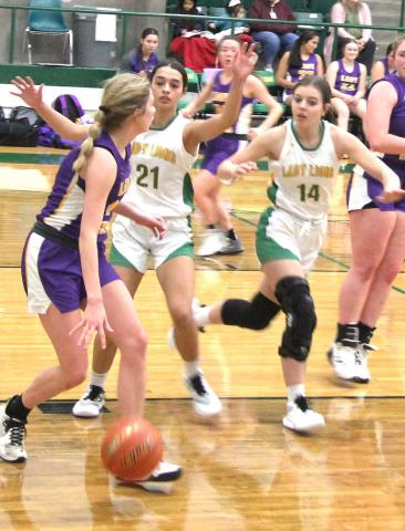 Paul Gaudette | Citizen staff photo Lady Lions Olivia Salyer and Madison Turley move in to box in an opponent during a recent home game.