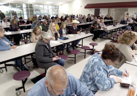 A crowd of people gathers for a meeting Saturday, March 28 discussing the next steps to stop the KV765 Transmission line project. Ben Pate | Submitted photo